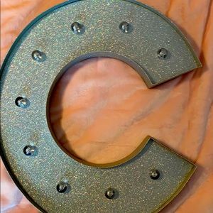 I am selling a fairly new C wall decor sign.